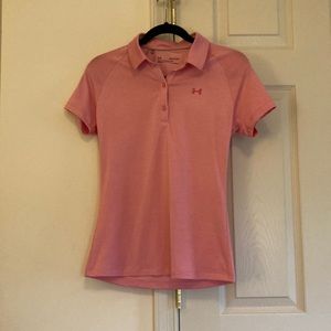 A pink barely worn heat gear under armour collared shirt